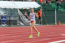 Woman celebrating on track and field track
